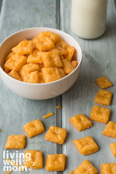 cheese crackers scattered on a table and filling a dish