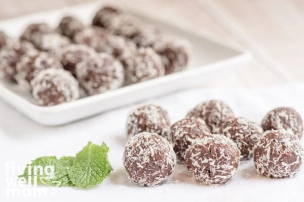 chocolate mint balls with coconut and fresh mint leaves