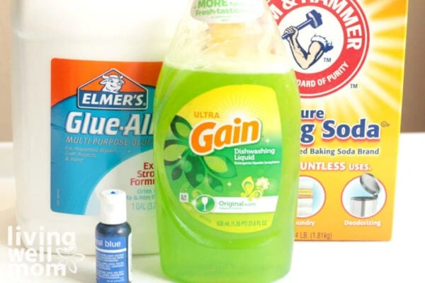 Supplies needed for slime without borax - glue, baking soda, gain dish soap, and food coloring.