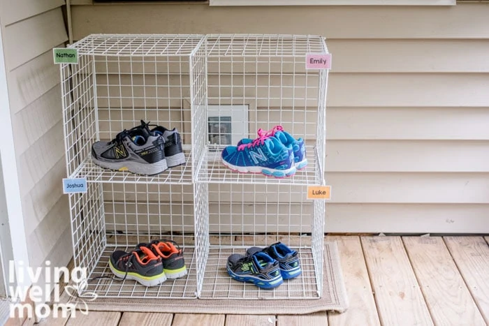 diy kids' shoe rack on a porch