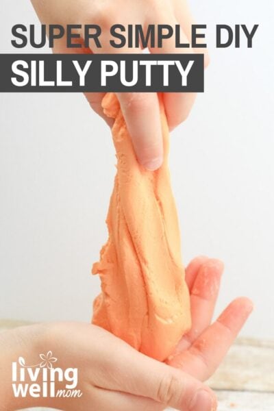 child pulling homemade orange silly putty 