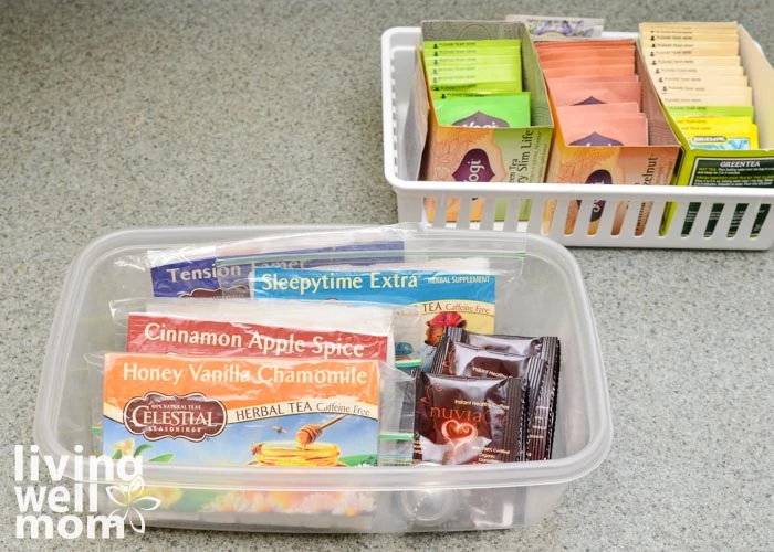 Two plastic bins each holding organized tea bags