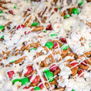 Popcorn mixed with m&ms and pretzels, then drizzled with white chocolate