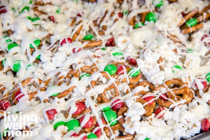 Popcorn mixed with m&ms and pretzels, then drizzled with white chocolate
