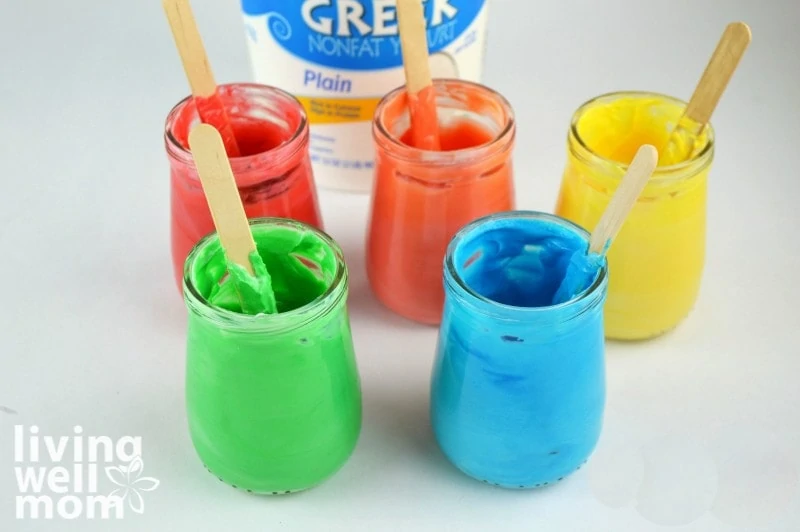 5 baby food jars filled with edible paint for babies and toddlers