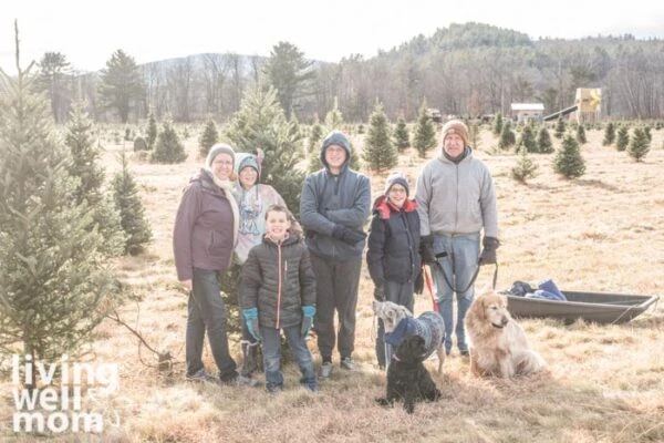 family at a christmas tree farm 