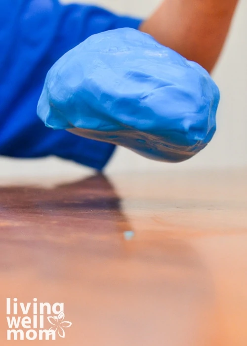 blue homemade Gak slime bouncing on a table