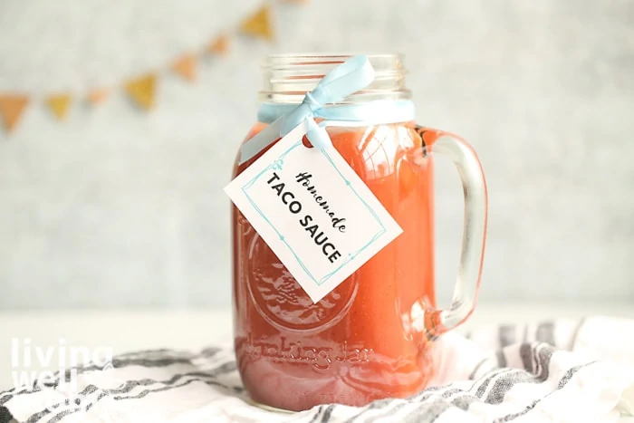 jar of taco sauce with cute label tag tied around it