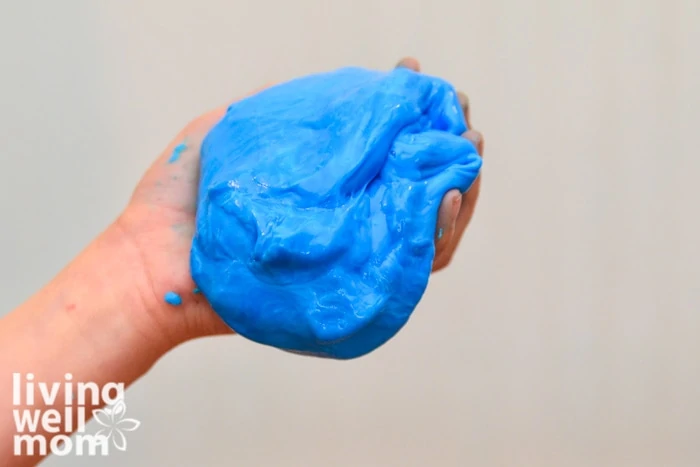 boy holding blue gak in hand