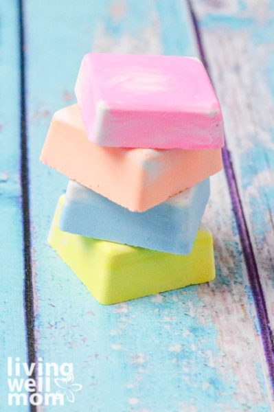Stack of colorful homemade chalk on a blue table