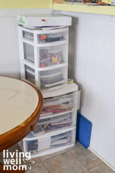 Plastic bins with drawers in the corner of a kitchen