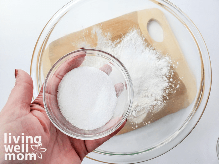 Mixing bowls of dry ingredients for homemade bath salts. 