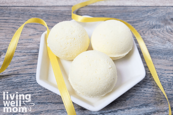 DIY Bath Bombs displayed on a glass plate. 