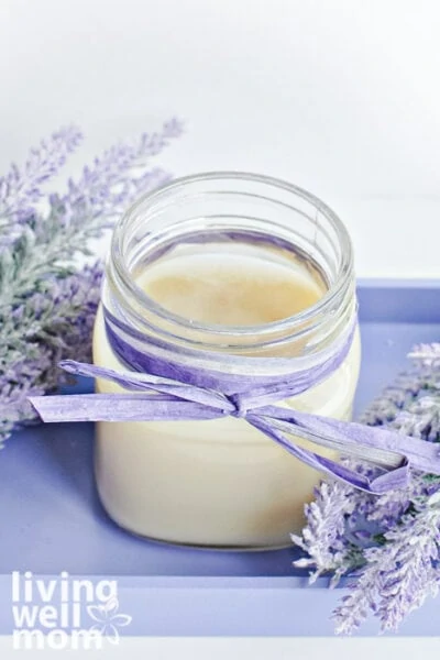 Mason jar with DIY cracked heel cream nestled in lavender