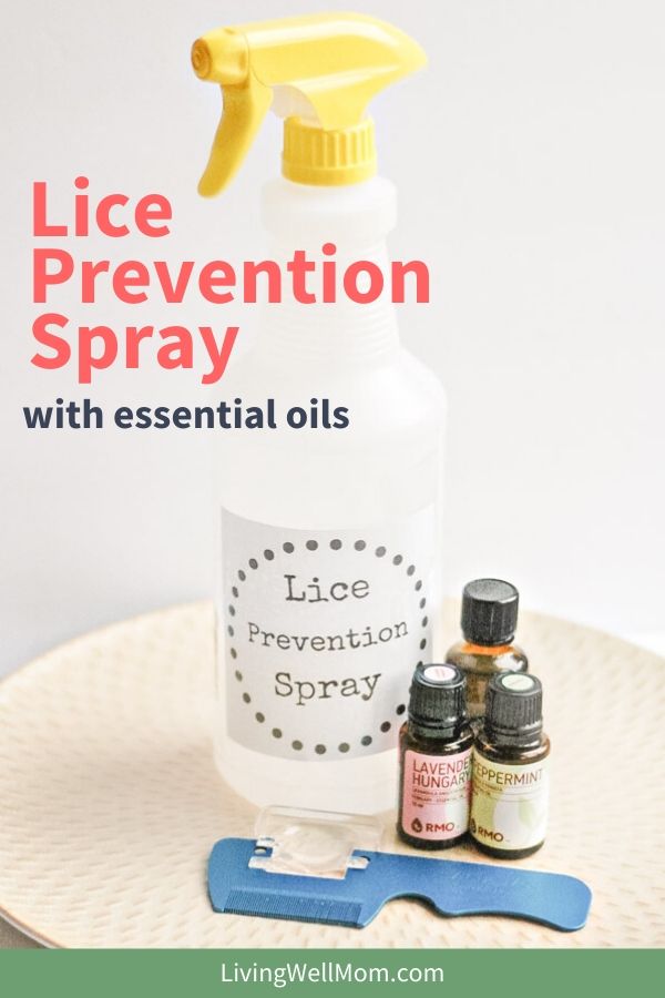 bottle of lice prevention spray next to essential oils