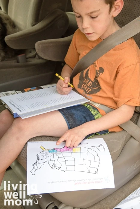 Child in a car playing a license plate game
