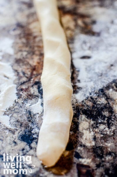 eggnog dough being shaped into a log before baking