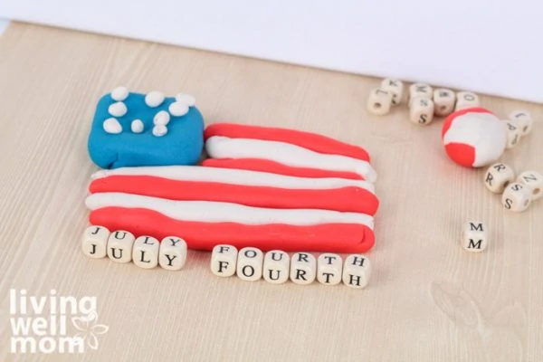 American flag made out of red, white, and blue playdough.