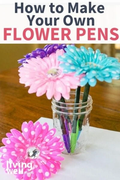 a vase with homemade pink purple and blue flower pens