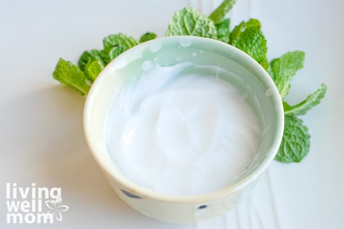 Bowl of DIY foot lotion with peppermint