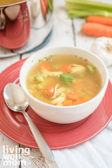 Bowl of whole30 chicken soup with celery and carrots