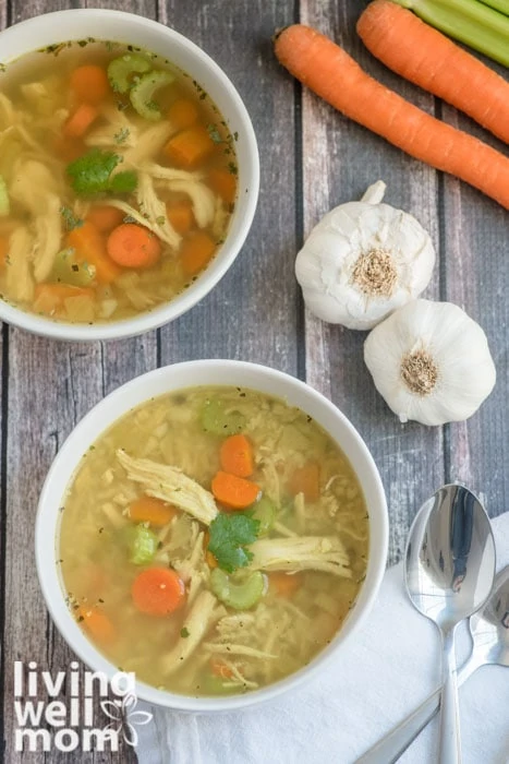 Paleo soup with 2 bulbs of garlic, chicken, carrots and celery