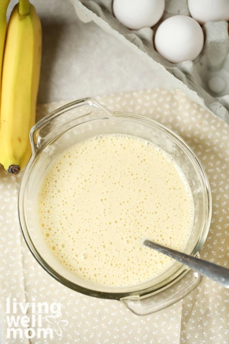 batter for banana egg pancakes in a glass bowl