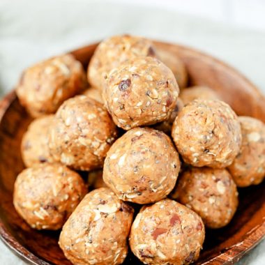 Close up of a bowl of energy balls with peanut butter