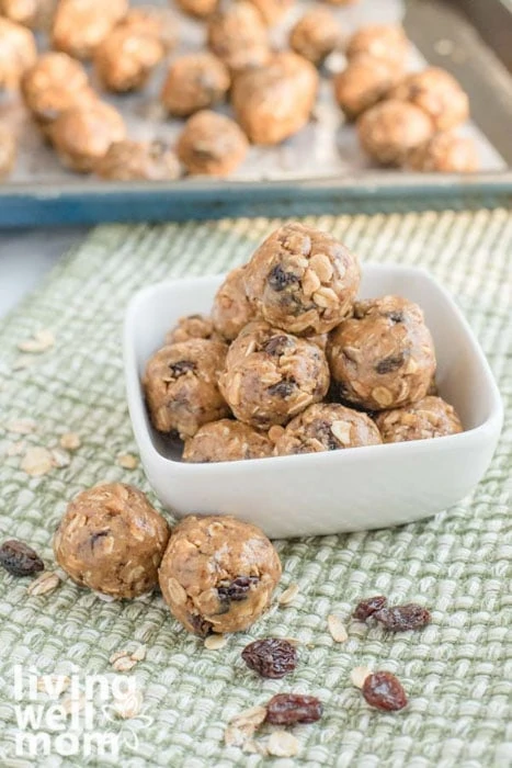 Peanut butter balls with raisin and flax seed in a bowl