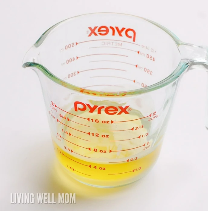 Melted beeswax and coconut oil in a large measuring cup