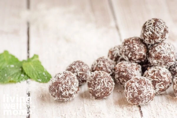 freshly made chocolate mint balls on a wooden surface