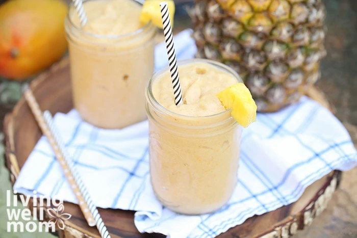 mango pineapple smoothie in a mason jar