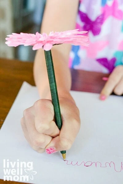 Girl holding a DIY flower pen