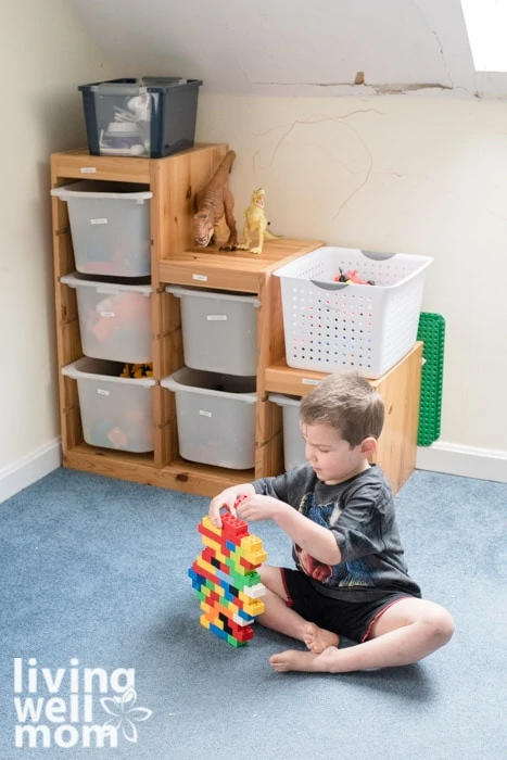 boy playing with legos