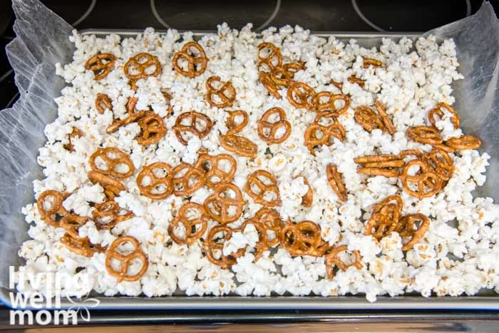 Pretzels over popcorn on baking sheet