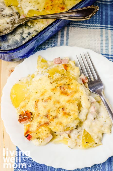 Plate full of a scalloped potatoes and ham