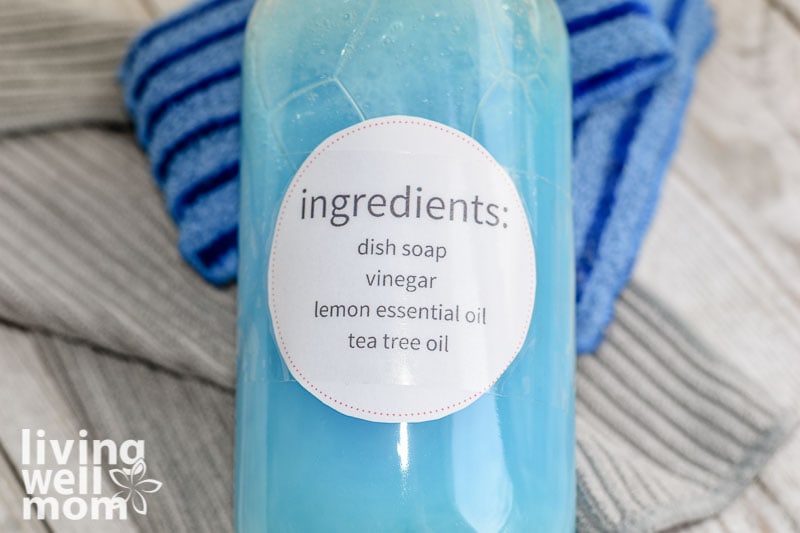 label with ingredients on glass blue bottle for shower cleaner recipe
