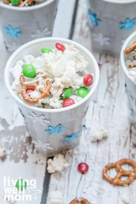 solo cup decorated with stickers and white chocolate popcorn inside the cup