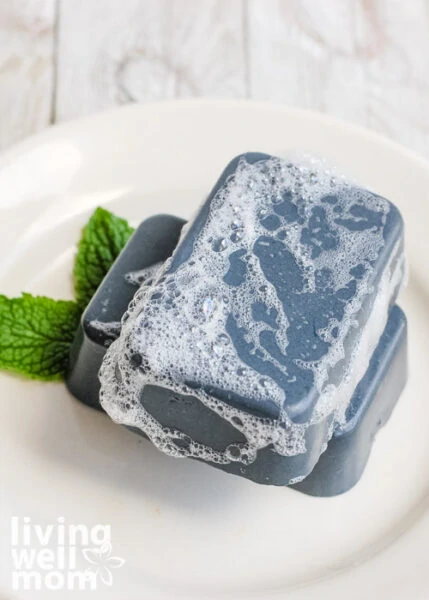 charcoal soap bar with suds on top