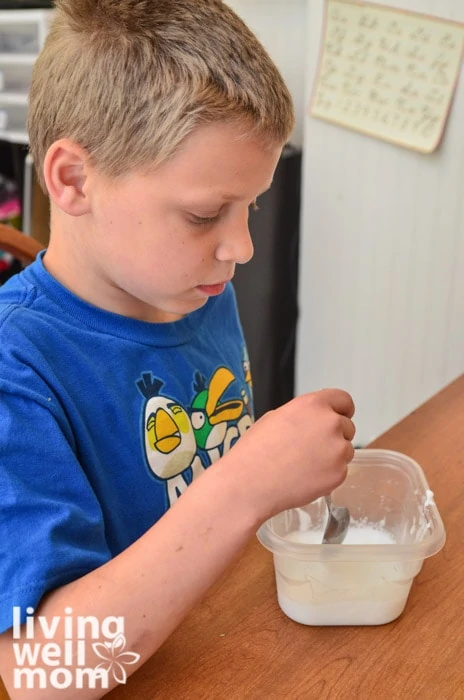 stirring together glue and water