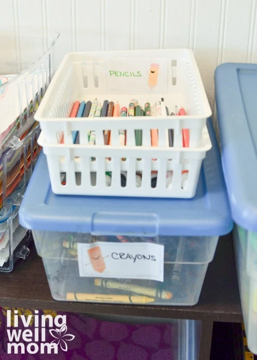 bins filled with crayons and pencils